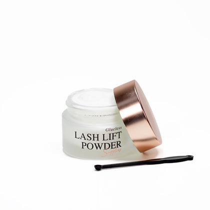 Lash lift powder jar with brush on a white background